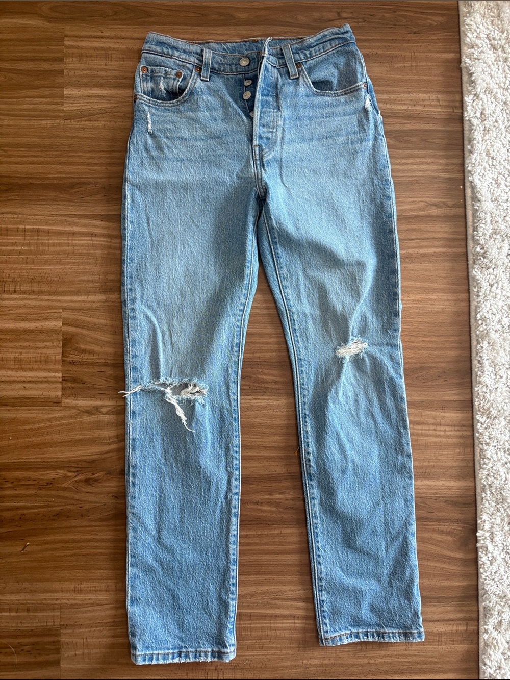 Light Blue Distressed Women’s Levi’s 501 denim jeans